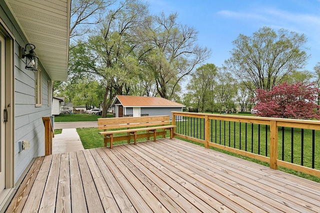 wooden deck featuring a lawn