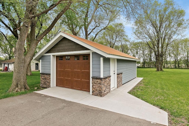 garage with a lawn