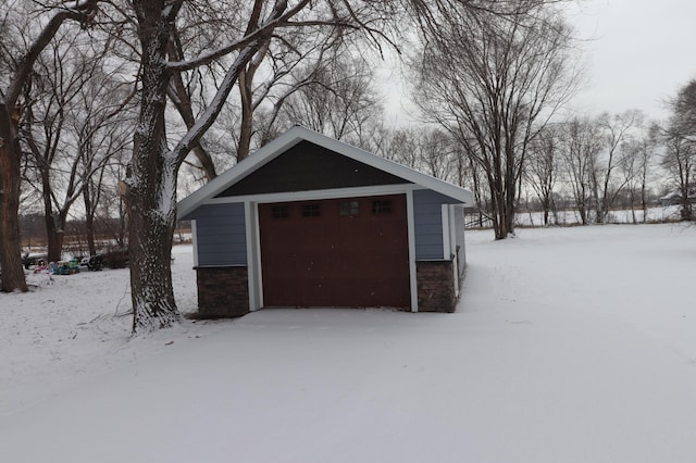 view of snow covered garage