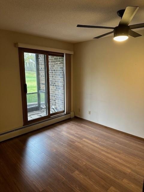 spare room with hardwood / wood-style floors, a textured ceiling, a baseboard radiator, and ceiling fan