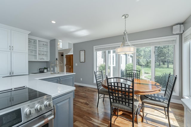 kitchen featuring dark wood finished floors, white cabinets, electric stove, light countertops, and open shelves