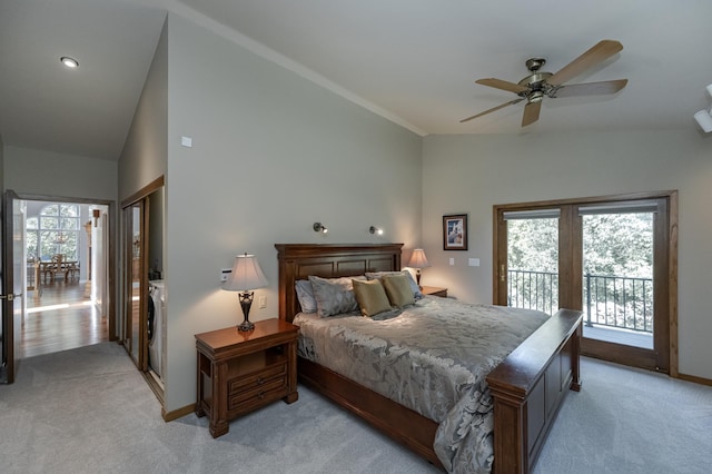 bedroom featuring access to exterior, light carpet, vaulted ceiling, and baseboards