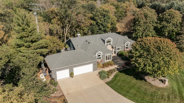 drone / aerial view featuring a view of trees