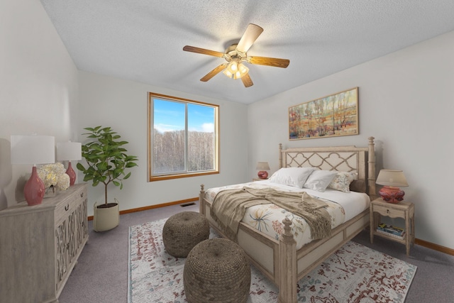 bedroom with light carpet, a textured ceiling, and ceiling fan