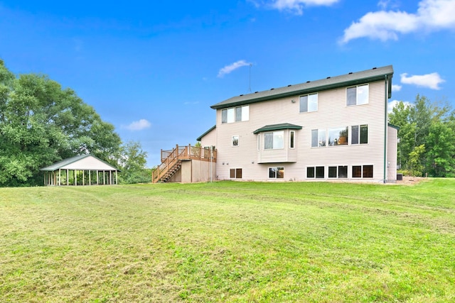 back of property featuring a yard and a deck