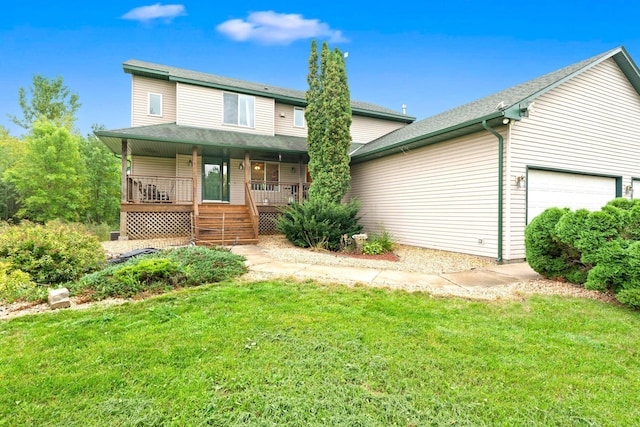 view of front of home with a porch, a garage, and a front lawn