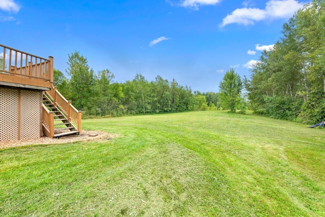 view of yard with a wooden deck