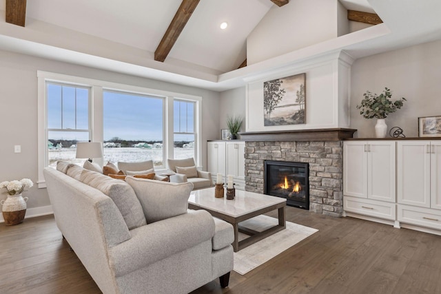 living room featuring high vaulted ceiling, dark wood-type flooring, beamed ceiling, and a fireplace