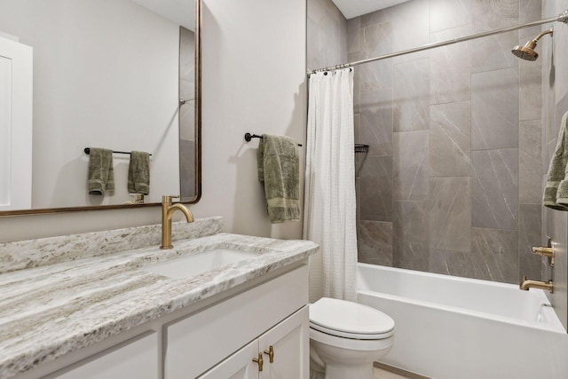 full bathroom featuring toilet, shower / bath combination with curtain, and vanity