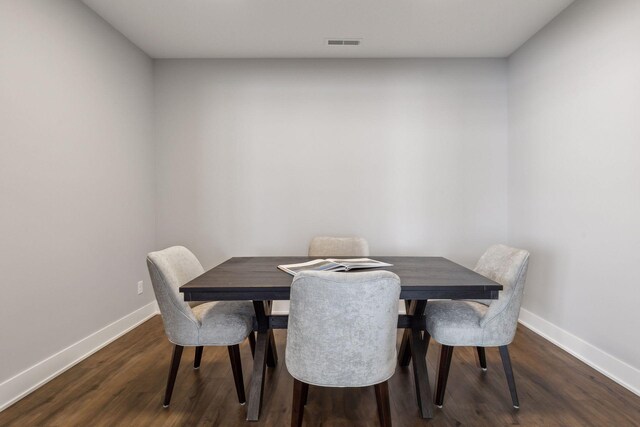 dining room with dark wood-type flooring