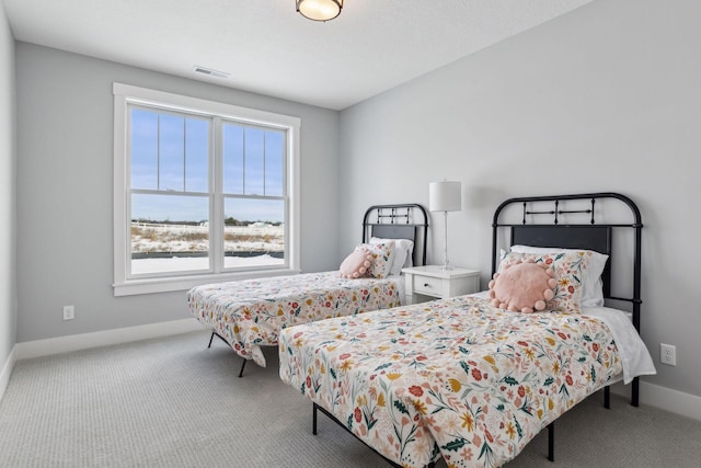 bedroom with light colored carpet