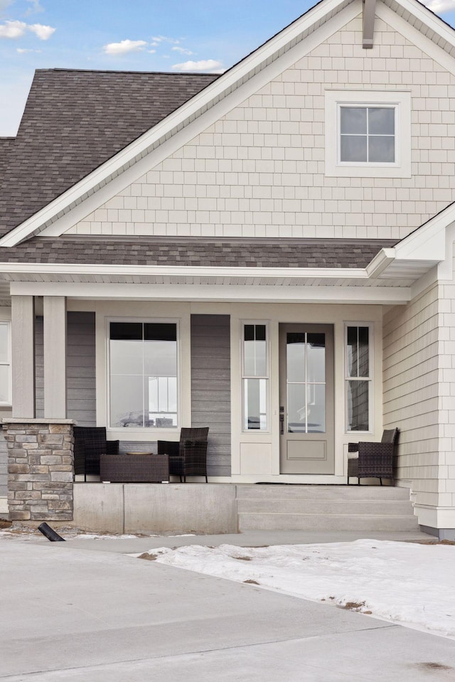 view of exterior entry featuring a porch