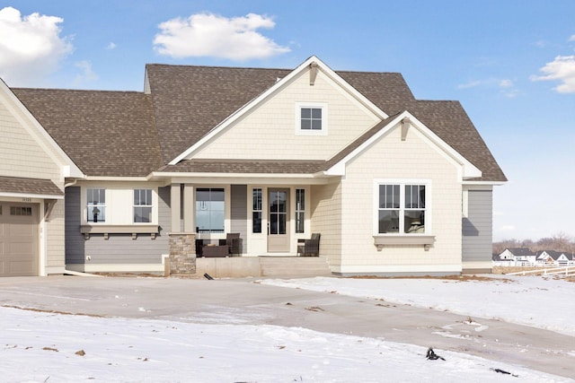 craftsman house with a garage and a porch