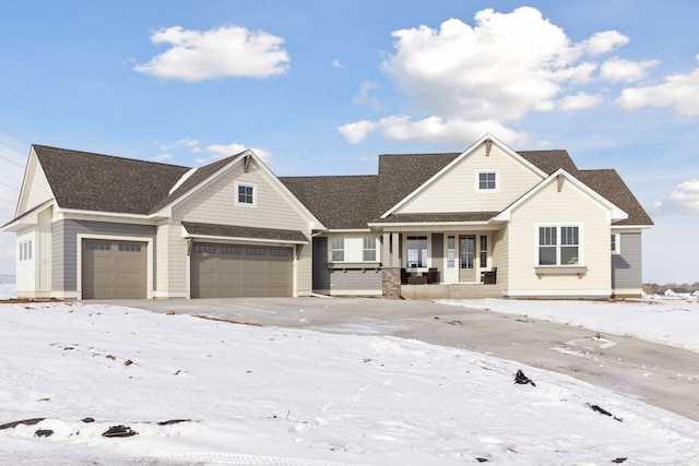 craftsman house featuring covered porch and a garage