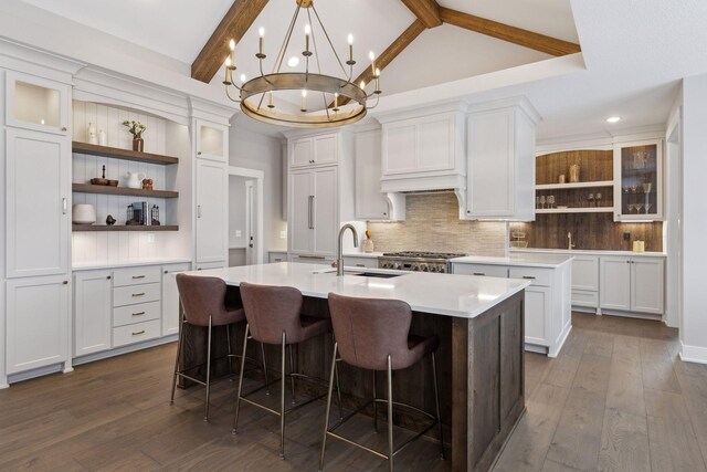 14320 47th St N, Stillwater, MN 55082 - kitchen featuring open shelves, a center island with sink, decorative backsplash, white cabinets, and recessed lighting