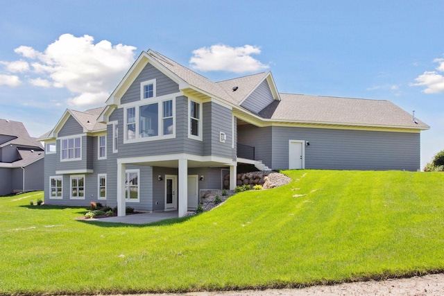 14320 47th St N, Stillwater, MN 55082 - back of property featuring a patio, a yard, and a shingled roof
