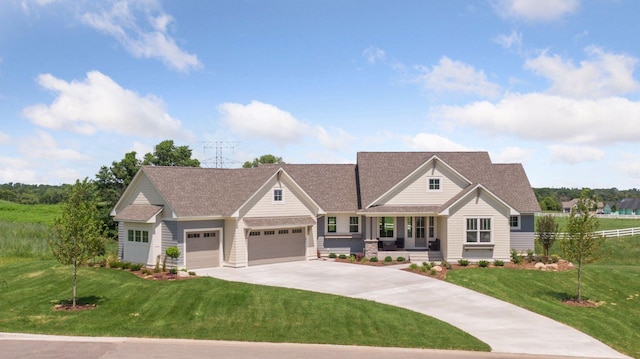 14320 47th St N, Stillwater, MN 55082 - craftsman house featuring covered porch, driveway, an attached garage, a front yard, and roof with shingles