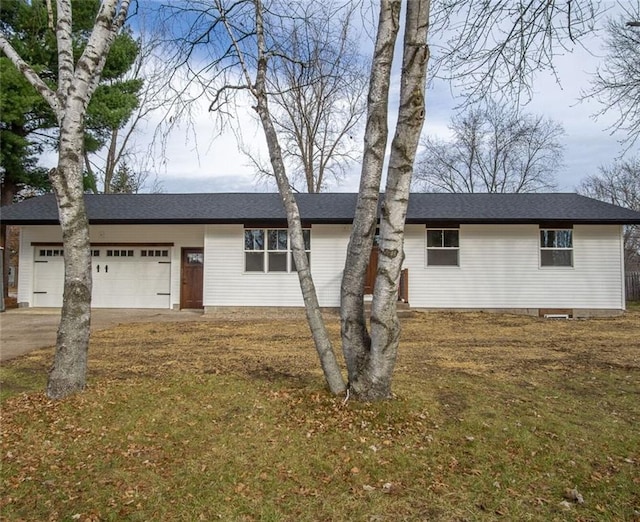 ranch-style home featuring a garage