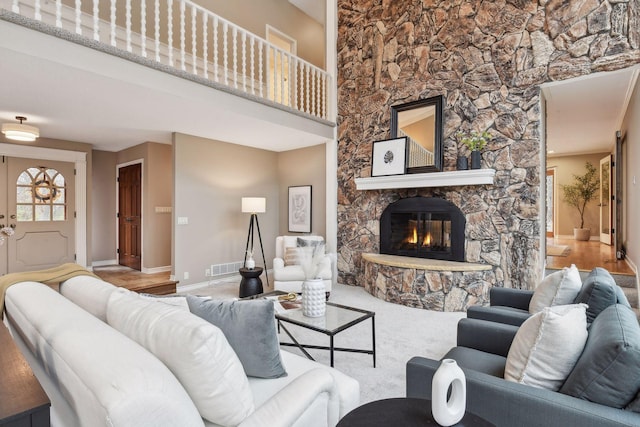 living room with hardwood / wood-style floors and a fireplace