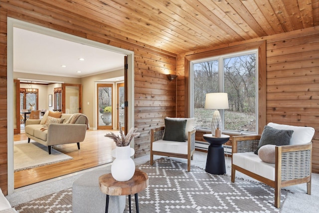 living area featuring wooden ceiling and hardwood / wood-style flooring