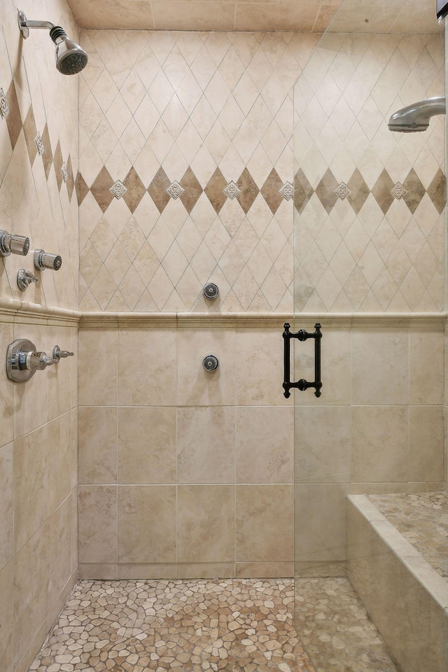 bathroom with a shower with shower door