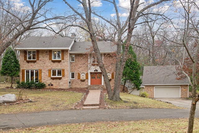 view of front of house featuring a garage and a front yard