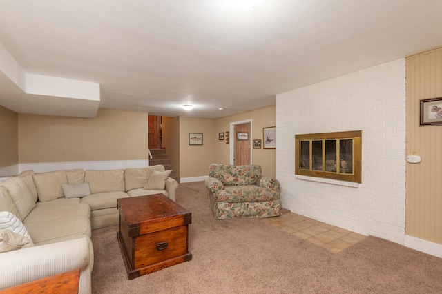 carpeted living room with a brick fireplace