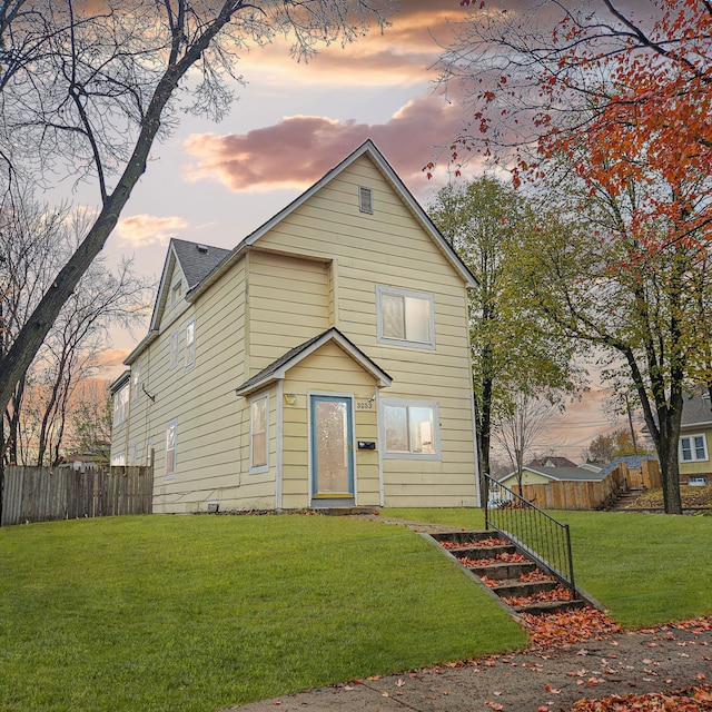 front facade with a yard