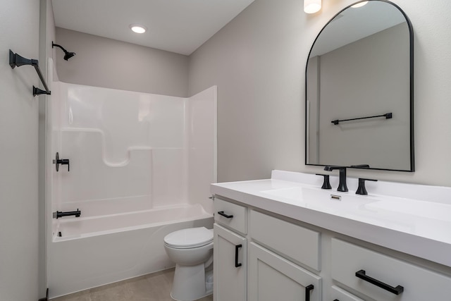 bathroom with vanity, shower / bathing tub combination, and toilet