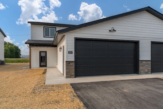 3104 Scotch Ln, Mankato, MN 56001 - view of front of house with stone siding and central AC unit
