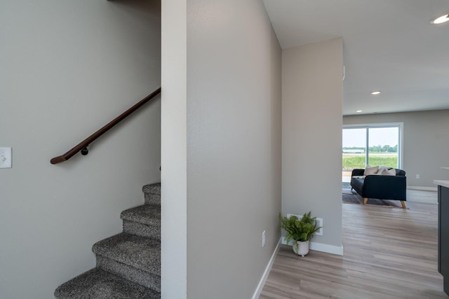3104 Scotch Ln, Mankato, MN 56001 - staircase with wood finished floors, recessed lighting, and baseboards