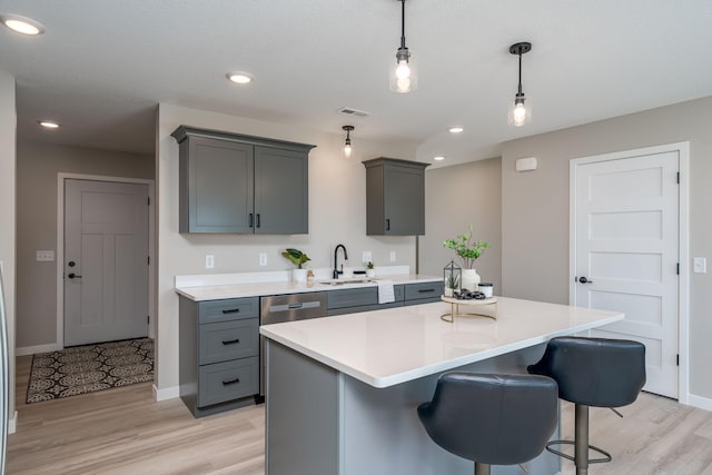 3104 Scotch Ln, Mankato, MN 56001 - kitchen featuring gray cabinetry, a sink, light wood-style flooring, light countertops, and recessed lighting