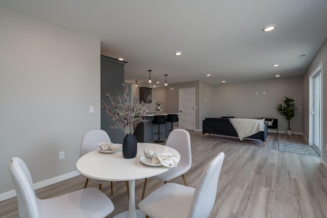 3104 Scotch Ln, Mankato, MN 56001 - dining area featuring baseboards, light wood-style floors, and recessed lighting