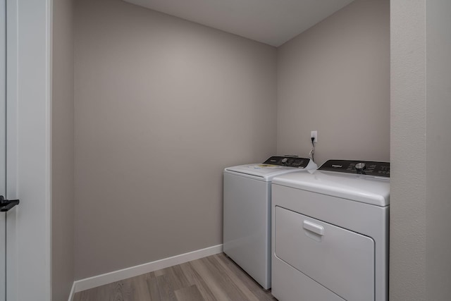 3104 Scotch Ln, Mankato, MN 56001 - laundry room featuring independent washer and dryer, light wood-style floors, and baseboards