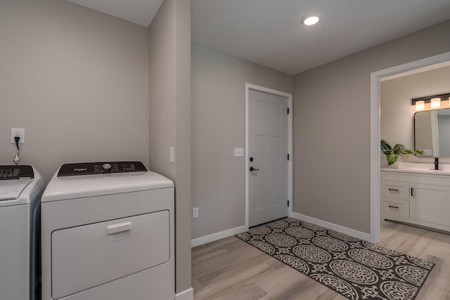 3104 Scotch Ln, Mankato, MN 56001 - laundry area with independent washer and dryer, light wood-style flooring, baseboards, and recessed lighting