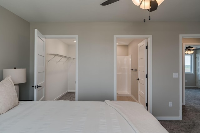 3104 Scotch Ln, Mankato, MN 56001 - carpeted bedroom with a walk in closet, baseboards, a closet, ensuite bathroom, and ceiling fan
