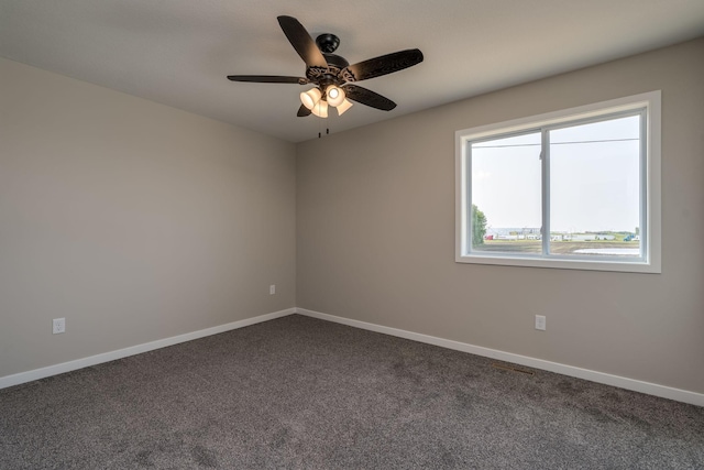 3104 Scotch Ln, Mankato, MN 56001 - unfurnished room with ceiling fan, dark colored carpet, and baseboards
