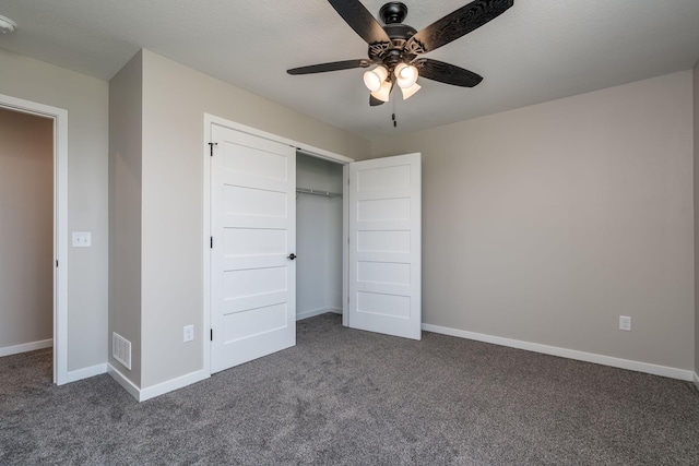 3104 Scotch Ln, Mankato, MN 56001 - unfurnished bedroom with dark colored carpet, a closet, baseboards, and a ceiling fan