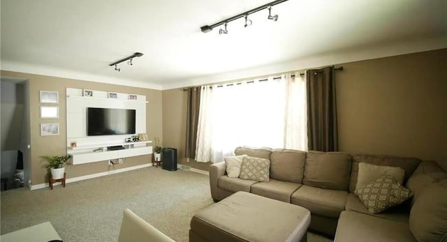 living room with carpet flooring and rail lighting