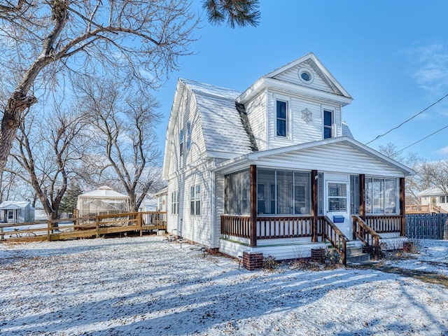 view of front of house featuring a gazebo and a sunroom