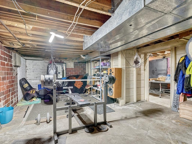 basement with brick wall