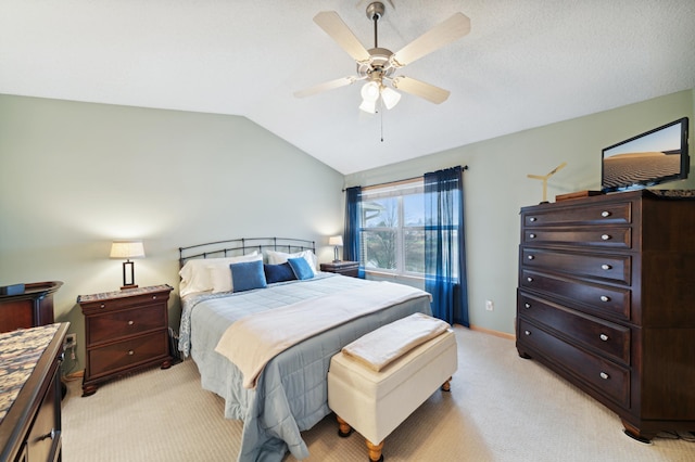 bedroom with light colored carpet, ceiling fan, and lofted ceiling