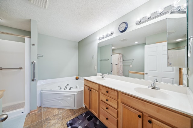 bathroom featuring vanity, a textured ceiling, and plus walk in shower