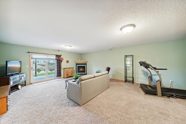 carpeted living room featuring a textured ceiling