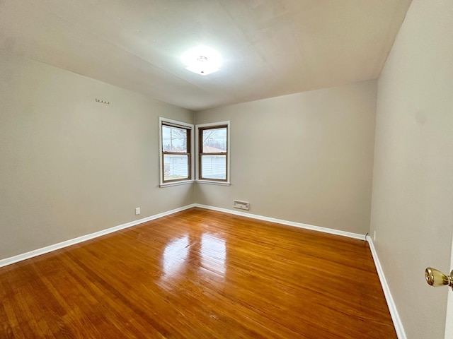 unfurnished room featuring wood-type flooring