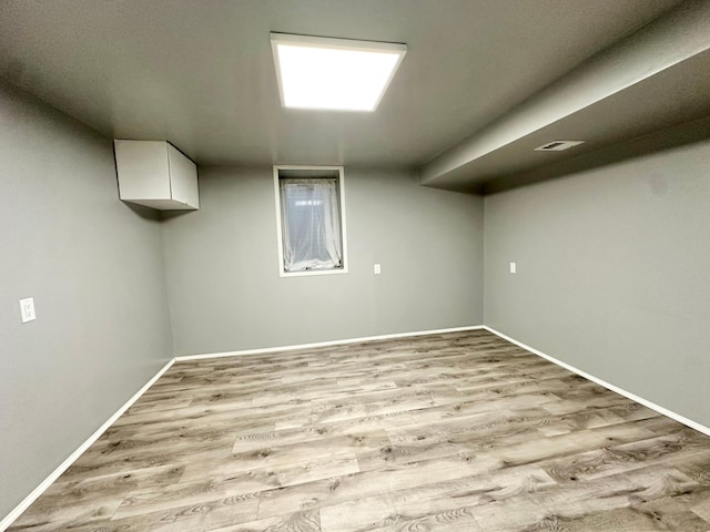 basement featuring light hardwood / wood-style floors