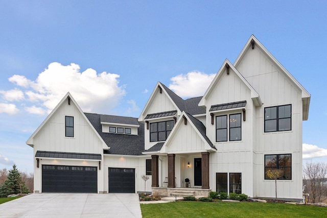 modern farmhouse style home featuring a garage and a front lawn