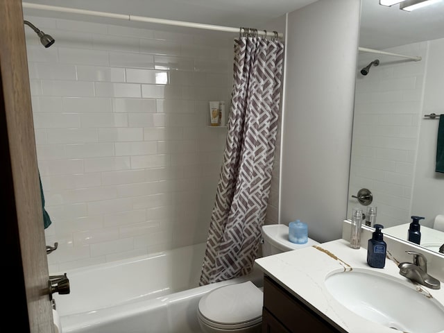 full bathroom featuring vanity, toilet, and shower / tub combo