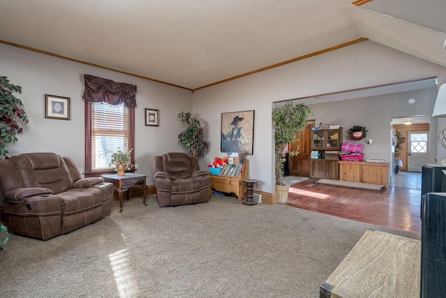 living room with ornamental molding, vaulted ceiling, and carpet floors