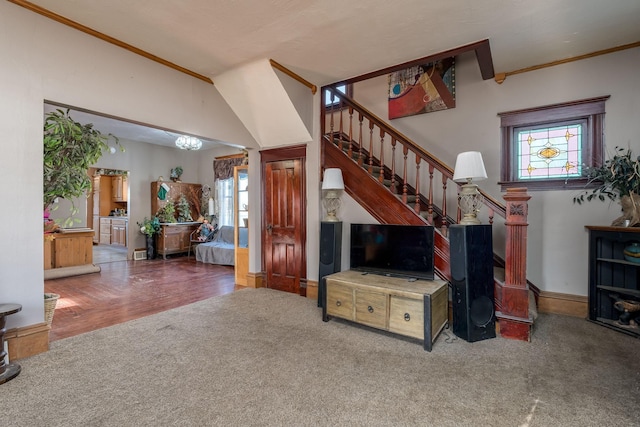 living room with carpet floors and ornamental molding